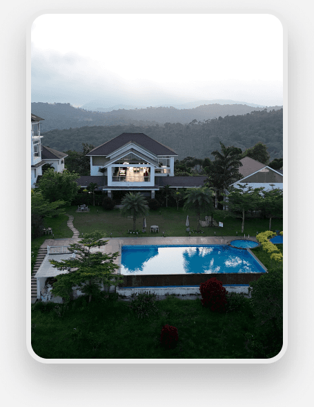 Aerial view of Sila villa with pool among misty hills